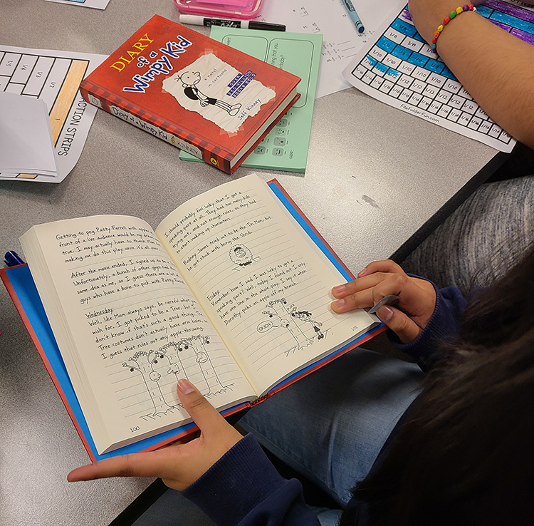 2022 April Winner reading the new book.